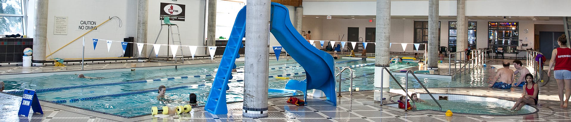 An indoor pool with a slide